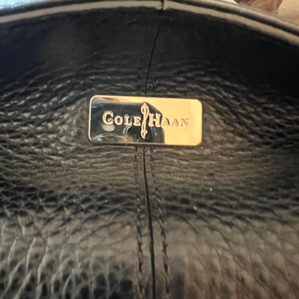 Cole Haan large pebbled black leather hobo bag with zipper.